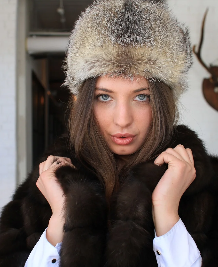 Woman wearing a fur hat and dark fur coat